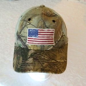 VGUC. Camouflage baseball cap with American flag patch.